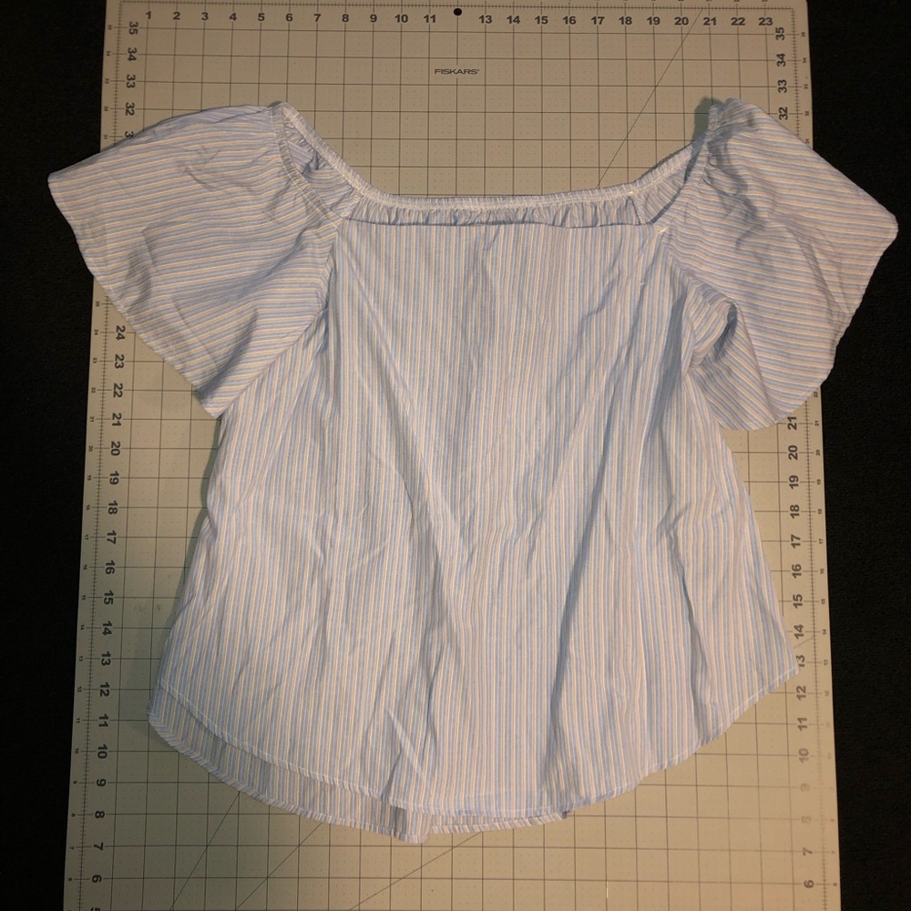 Haute Project Top. Size large. Light blue color.